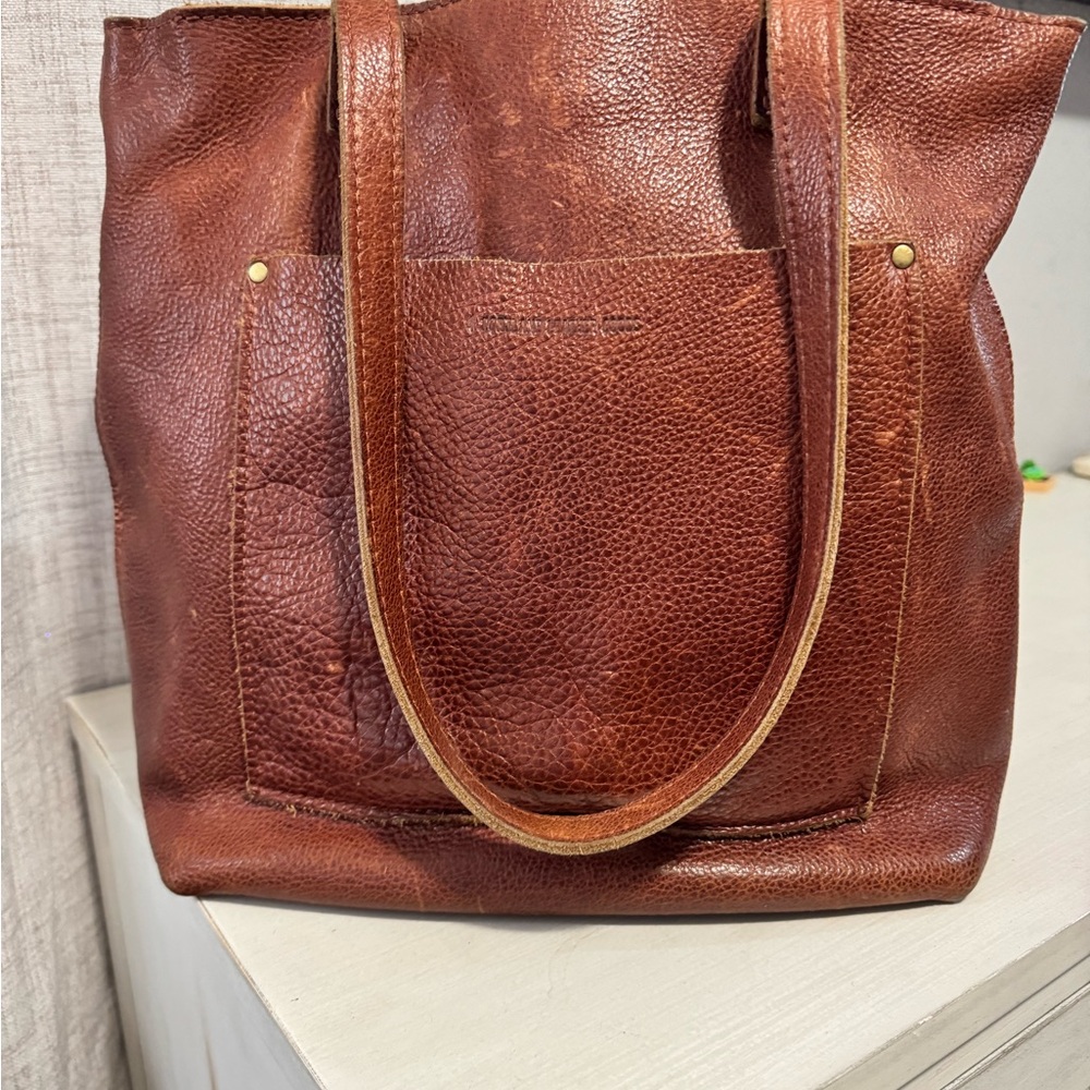 Portland leather goods 
Crossbody tote